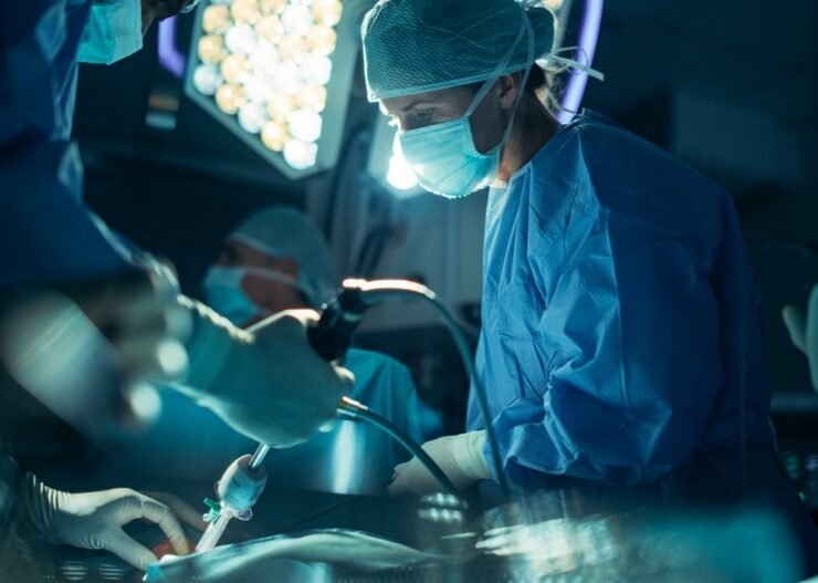 Portrait,Of,A,Female,Surgeon,Using,Laparoscopy,Instrument,,Working,On