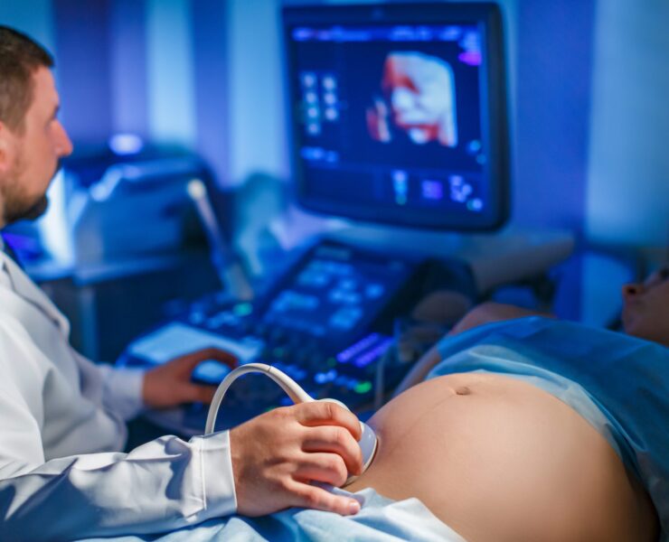 doctor-makes-ultrasound-scan-pregnant-woman-looks-screendrives-apparatus-2048x1365